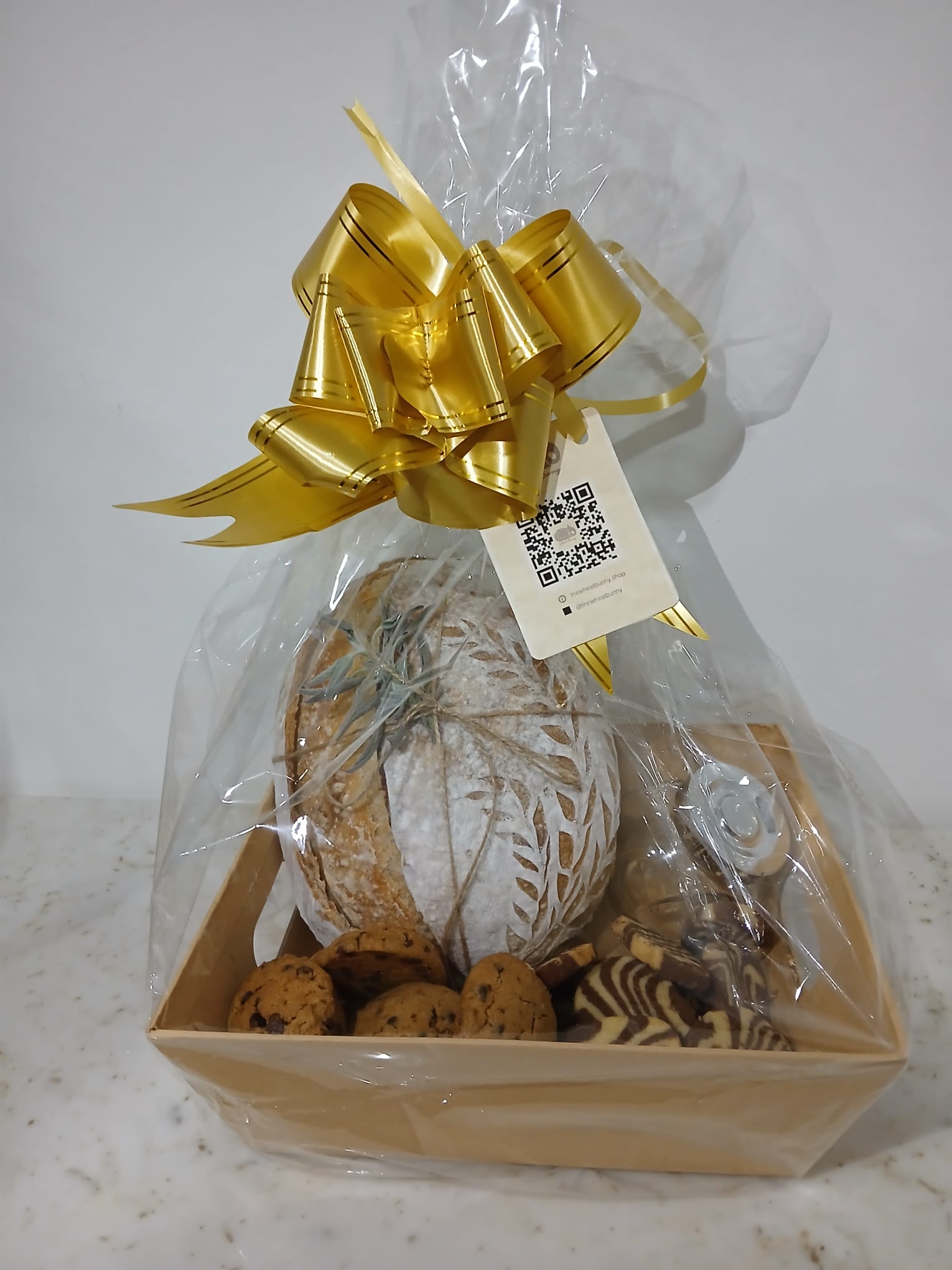 Customer photo with sourdough loaves and cookies